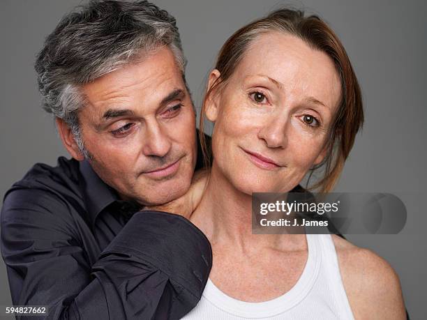 middle-aged couple - studio portrait stock pictures, royalty-free photos & images