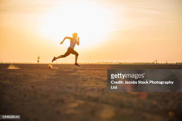 caucasian woman running in desert - hot arabian women stock pictures, royalty-free photos & images