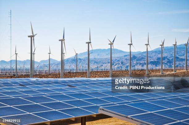 wind turbines and solar panels in remote landscape - the americas stock-fotos und bilder