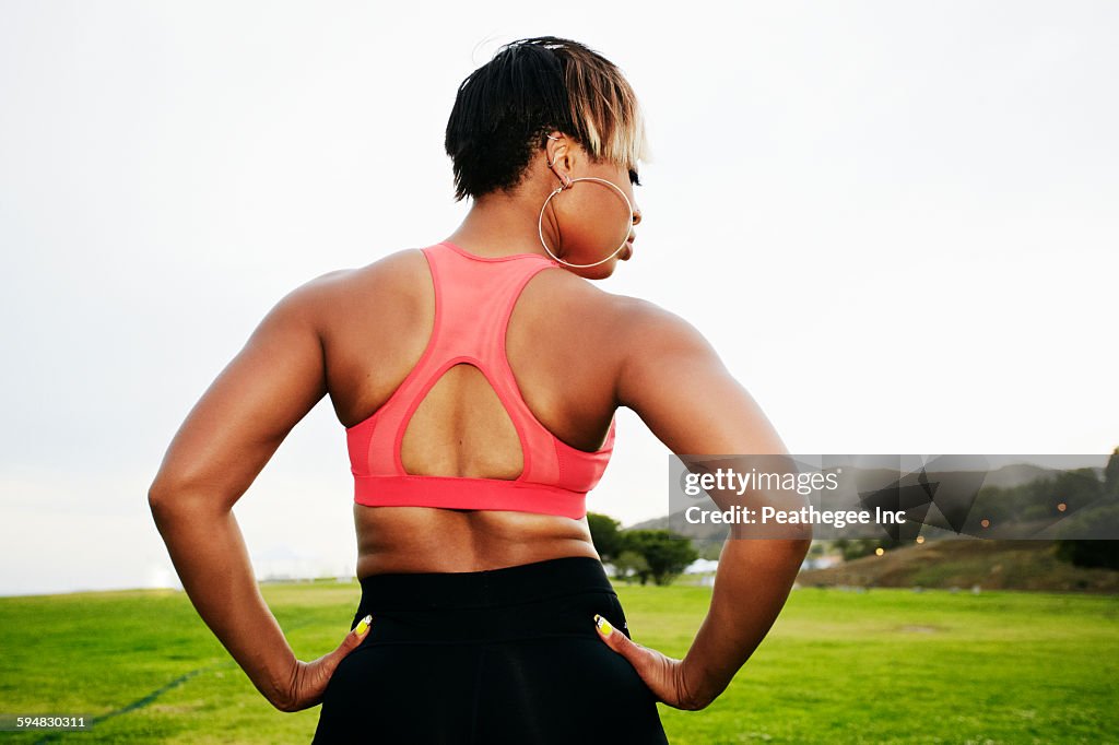 Black woman standing in field