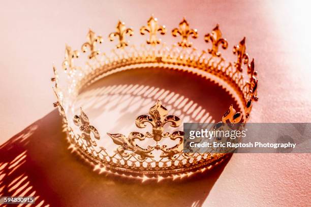 high angle view of crown and shadow - krone kopfbedeckung stock-fotos und bilder