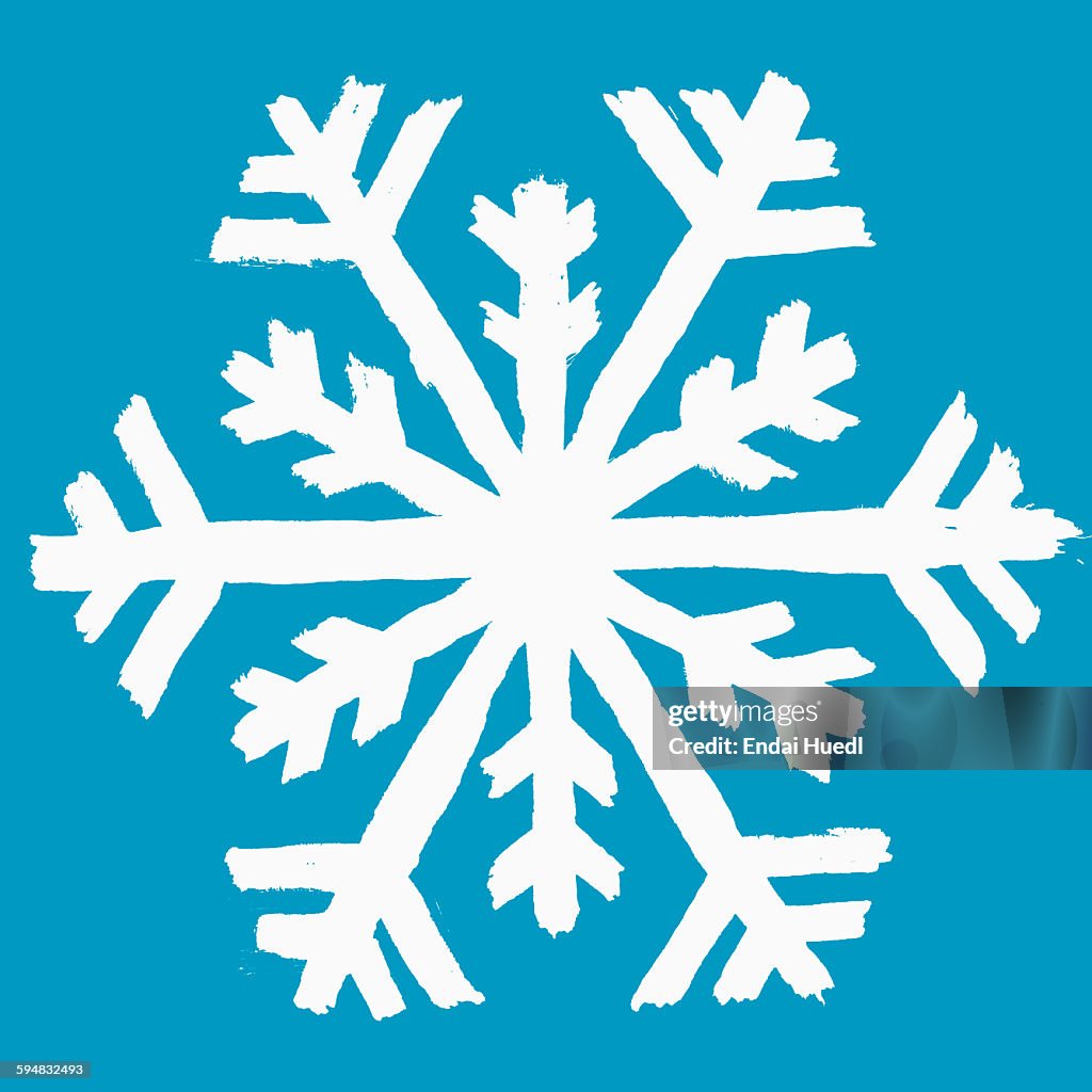 Illustration of snow flake against blue background