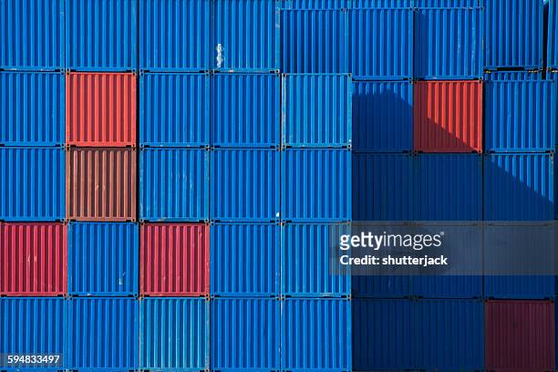 stacks of shipping containers in a row - container stock pictures, royalty-free photos & images