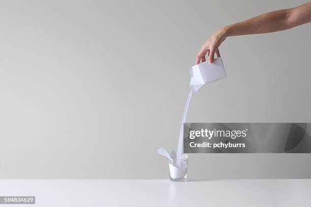 woman pouring conceptual milk into a glass - pouring imagens e fotografias de stock