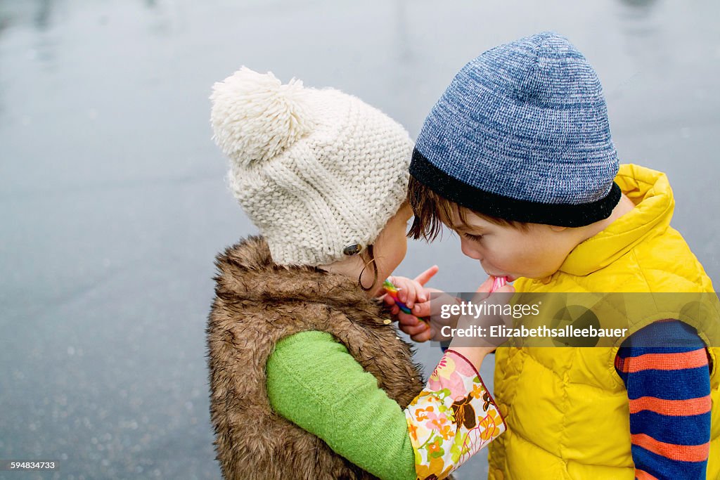 Boy and girl sharing sweets