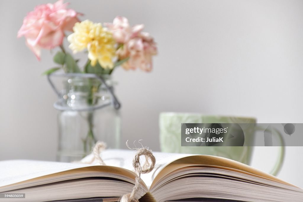 Book, coffee and flowers