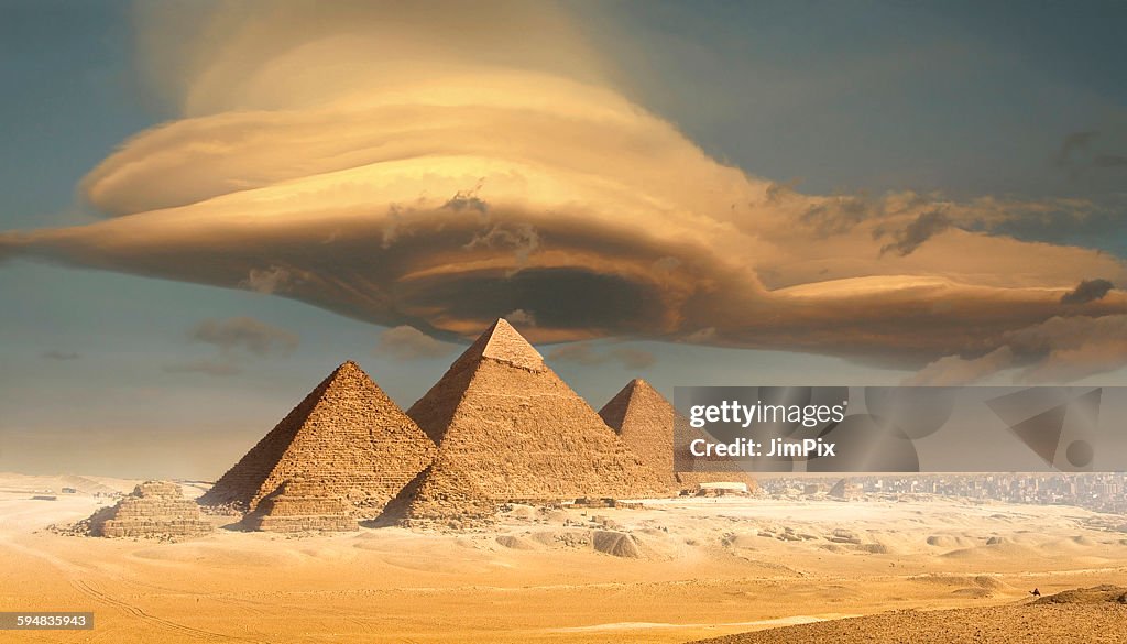 Dramatic storm cloud above pyramids, Giza, Egypt