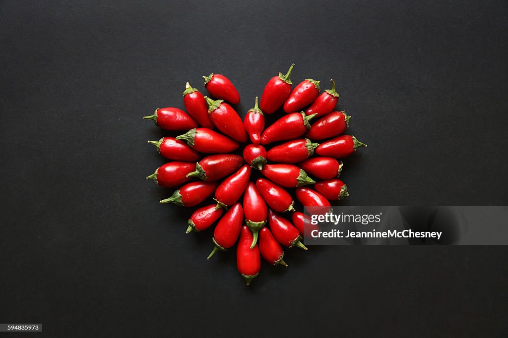Red jalapeno peppers in a heart shape