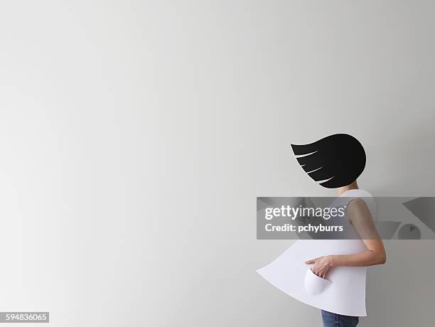 Conceptual woman with windswept hair and clothes