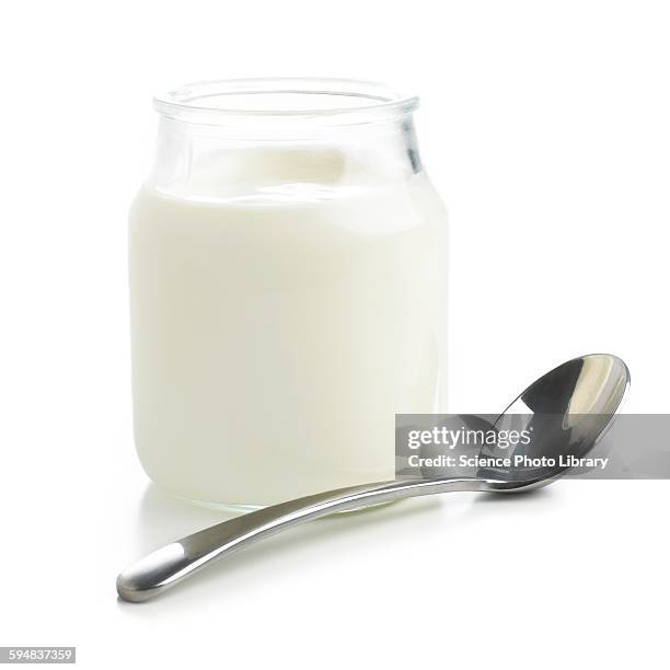 jar of fresh yoghurt and spoon - yoghurt stock pictures, royalty-free photos & images