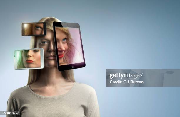 woman surrounded by three online devices that have glamorous images of her face - ugly face stockfoto's en -beelden