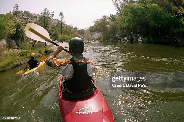 kayaking on river - white water kayaking stock pictures, royalty-free photos & images