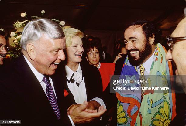 Frank Sinatra, Barbara Sinatra, and Luciano Pavarotti chat after The Three Tenors concert at Dodger Stadium, July 16, 1994 in Los Angeles. The...