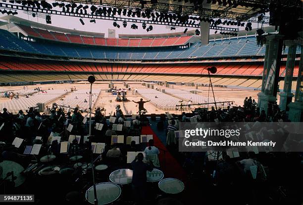 The Los Angeles Philharmonic rehearsing under the direction of conductor Zubin Mehta before The Three Tenors concert at Dodger Stadium, July 16, 1994...