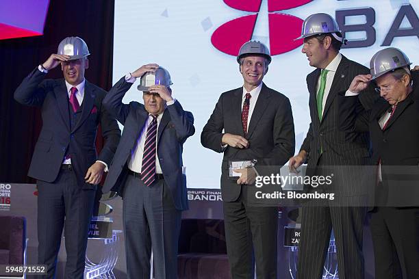 Jose Marcos Ramirez Miguel, chief executive officer of Grupo Financiero Banorte SAB, from left, Jose Antonio Fernandez, chairman of Fomento Economico...