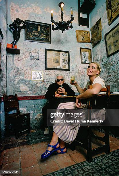 Actress and model Margaux Hemingway and owner Angel Martínez at the restaurant-bar, La Bodeguita del Medio, in February 1978 in Havana, Cuba. The...