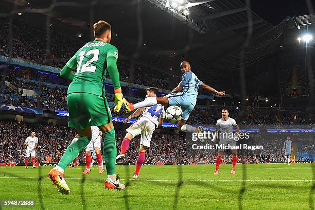 Fabian Delph of Manchester City scores the opening goal past Valentin Cojocaru of Steaua Bucharest during the UEFA Champions League Play-off Second...