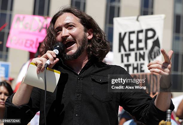 Comedian Lee Camp speaks during a rally on Dakota Access Pipeline August 24, 2016 outside U.S. District Court in Washington, DC. Activists held a...