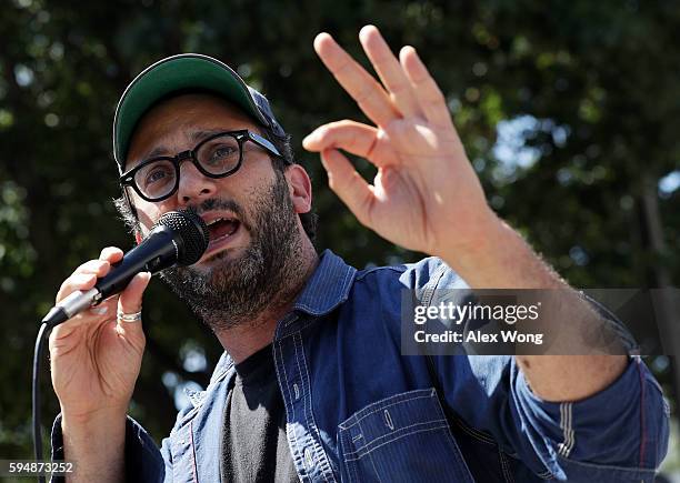 Film director Josh Fox speaks during a rally on Dakota Access Pipeline August 24, 2016 outside U.S. District Court in Washington, DC. Activists held...