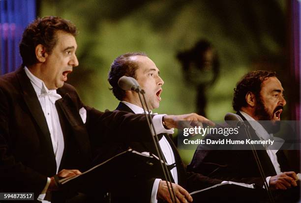 Plácido Domingo, José Carreras, and Luciano Pavarotti perform at The Three Tenors concert at Dodger Stadium, July 16, 1994 in Los Angeles. The...