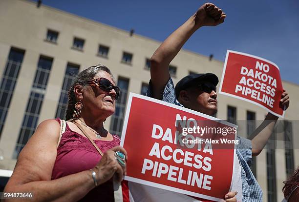 Members of the Red Lake Nation participate during a rally on Dakota Access Pipeline August 24, 2016 outside U.S. District Court in Washington, DC....
