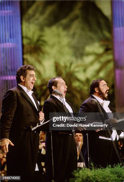 Plácido Domingo, José Carreras, and Luciano Pavarotti perform at The Three Tenors concert at Dodger Stadium, July 16, 1994 in Los Angeles. The...