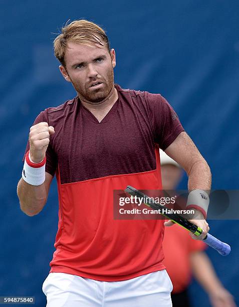 Bjorn Fratangelo of the United States reacts in his match against John Millman of Australia during the Winston-Salem Open at Wake Forest University...