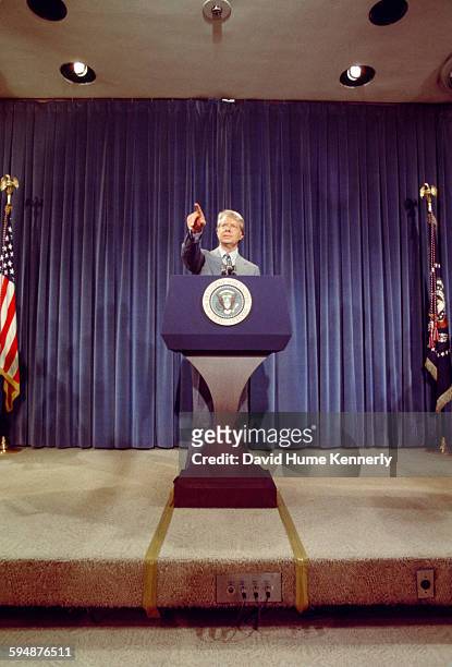 President Jimmy Carter taking questions from the press a presidential news conference at the Old Executive Office Building on April 15, 1977 in...