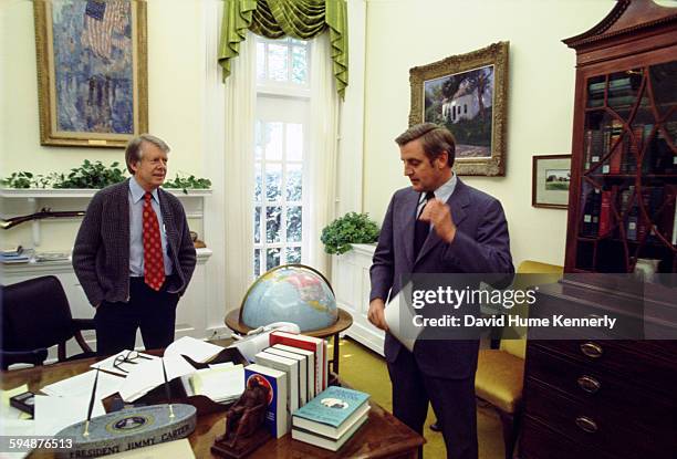 President Jimmy Carter and Vice President Walter Mondale in the President's private office, May 1977 in Washington, DC.