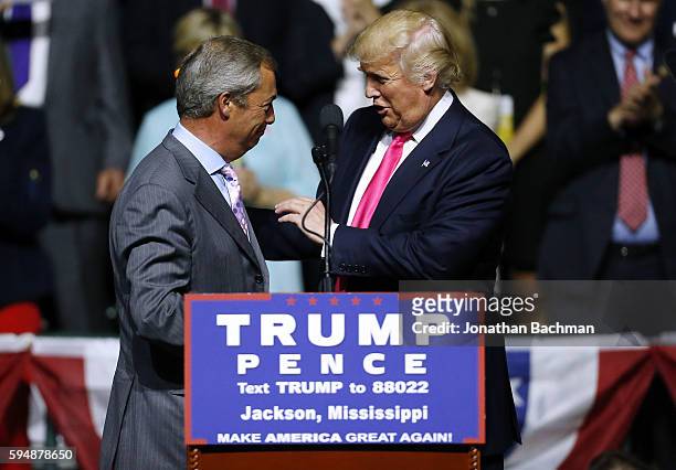 Republican Presidential nominee Donald Trump, right, greets United Kingdom Independence Party leader Nigel Farage during a campaign rally at the...