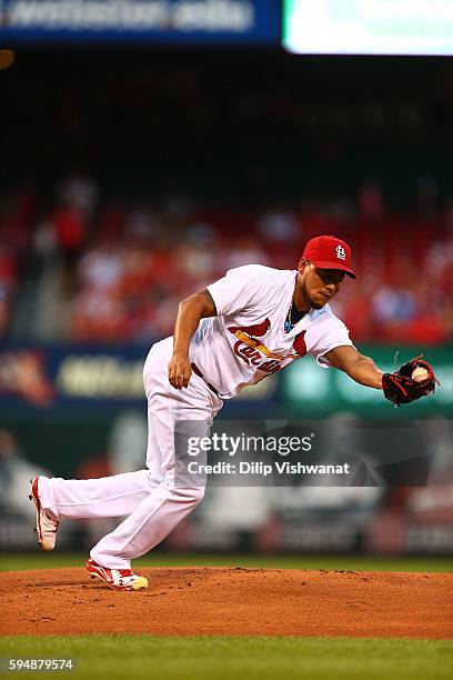 Starter Carlos Martinez of the St. Louis Cardinals catches a line drive against the New York Mets in the first inning at Busch Stadium on August 24,...