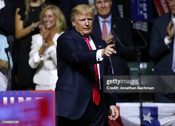 Republican Presidential nominee Donald Trump gestures to the crowd at a rally at the Mississippi Coliseum on August 24, 2016 in Jackson, Mississippi....