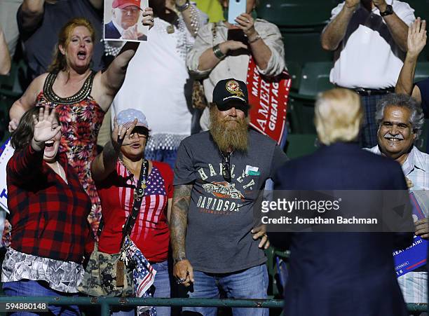 Supporters cheer for Republican Presidential nominee Donald Trump during a campaign rally at the Mississippi Coliseum on August 24, 2016 in Jackson,...
