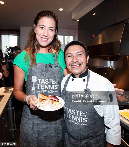 Garbiñe Muguruza and Chef Arturo Vivanco cook together during The Taste Of Tennis Master Class With St Giles Hotels at The Tuscany, A St Giles...