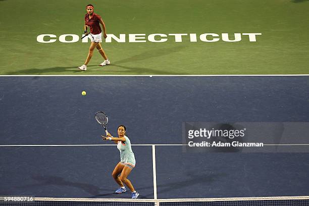 Sania Mirza of India and Monica Niculescu of Romania compete during their doubles match against Louisa Chirico and Alison Riske of the United States...