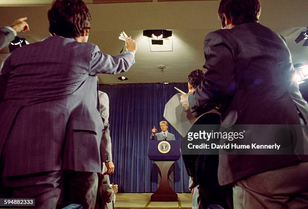 President Jimmy Carter takes questions from members of the press at a presidential news conference at the Old Executive Office Building, April 15,...