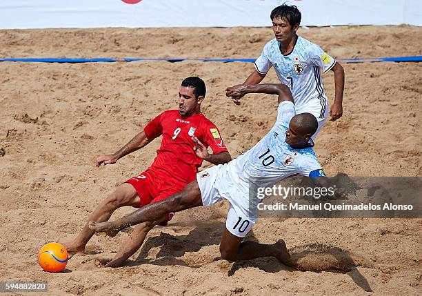 Ozu Moreira of Japan competes for the ball with Mohammadali Mokhtari of Iran during the Continental Beach Soccer Tournament match between Japan and...