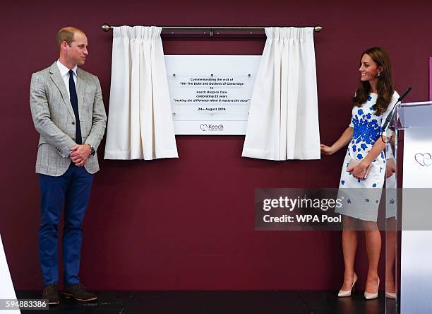 Catherine, Duchess of Cambridge and Prince William, Duke of Cambridge unveil a plaque for the hospice's 25th anniversary during their visit to Keech...