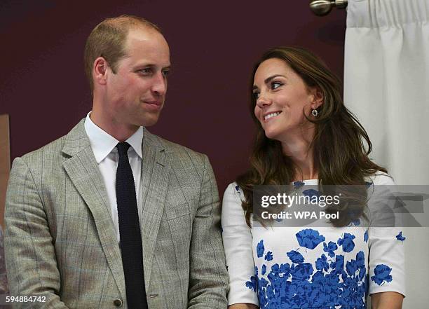 Catherine, Duchess of Cambridge and Prince William, Duke of Cambridge listen to a speech during their visit to Keech Hospice Care on August 24, 2016...