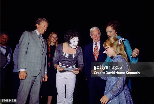 President Jimmy Carter and French mime artist Marcel Marceau with First Lady Rosalynn Carter and Amy Carter after Marceau's performance at the...