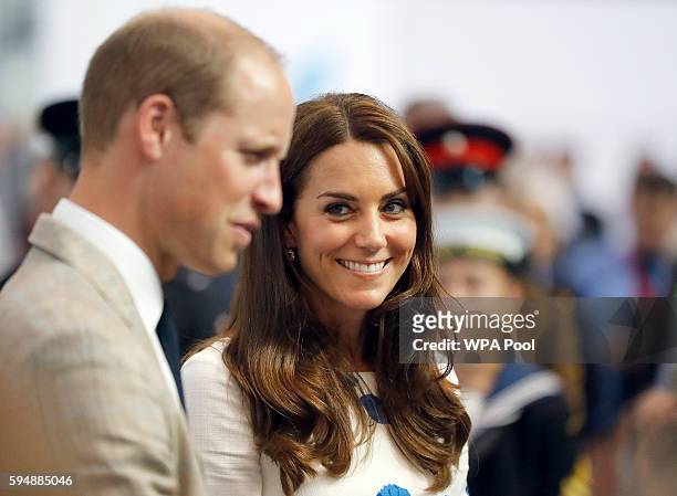 Catherine, Duchess of Cambridge and Prince William, Duke of Cambridge speak to employees during a visit and opening of the Centre of Excellence for...
