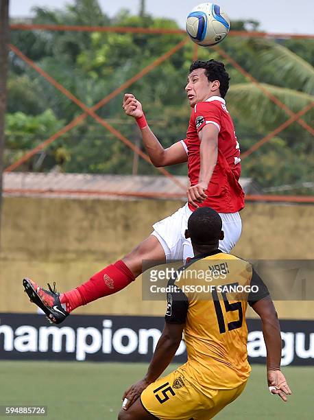 Al Ahly of Egypt's Amr Gamal Sayed vies with ASEC Mimosas of Ivory Coast's Nabi Ibrahim Kone during the CAF Champions League football match between...