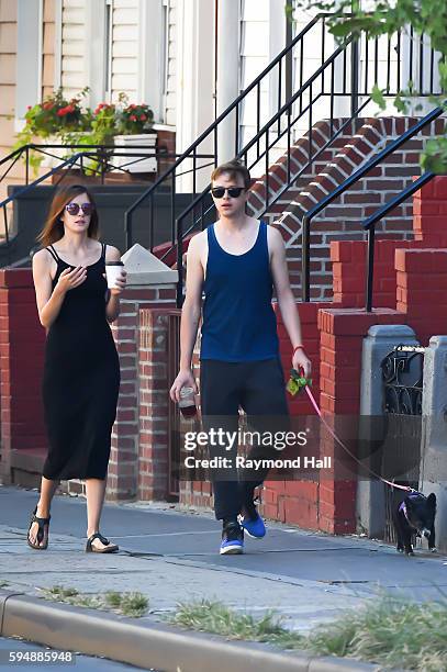 Actor Dane DeHaan and Anna Wood are seen walking their dog in Brooklyn on August 24, 2016 in New York City.