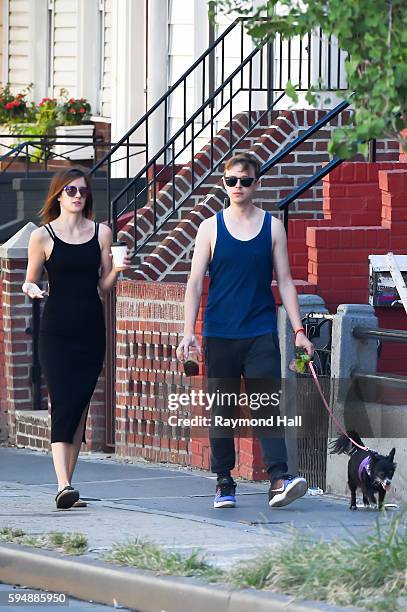 Actor Dane DeHaan and Anna Wood are seen walking their dog in Brooklyn on August 24, 2016 in New York City.