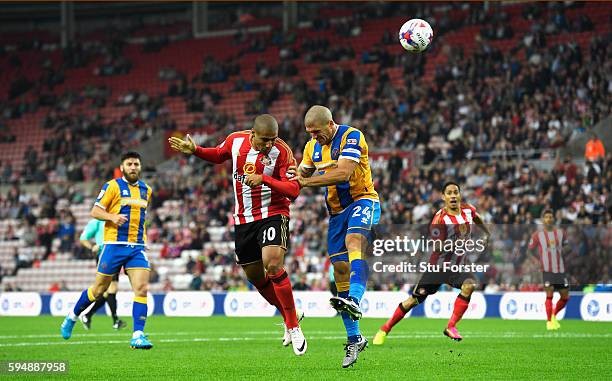 Wahbi Khazri of Sunderland jumps with Adam El-Abd of Shrewsbury Town as the header goes wide during the EFL Cup second round match between Sunderland...