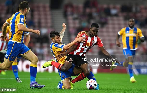 Joel Asoro of Sunderland is fouled by Gary Deegan of Shrewsbury Town during the EFL Cup second round match between Sunderland and Shrewsbury Town at...