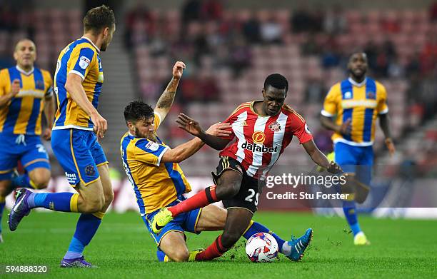 Joel Asoro of Sunderland is fouled by Gary Deegan of Shrewsbury Town during the EFL Cup second round match between Sunderland and Shrewsbury Town at...