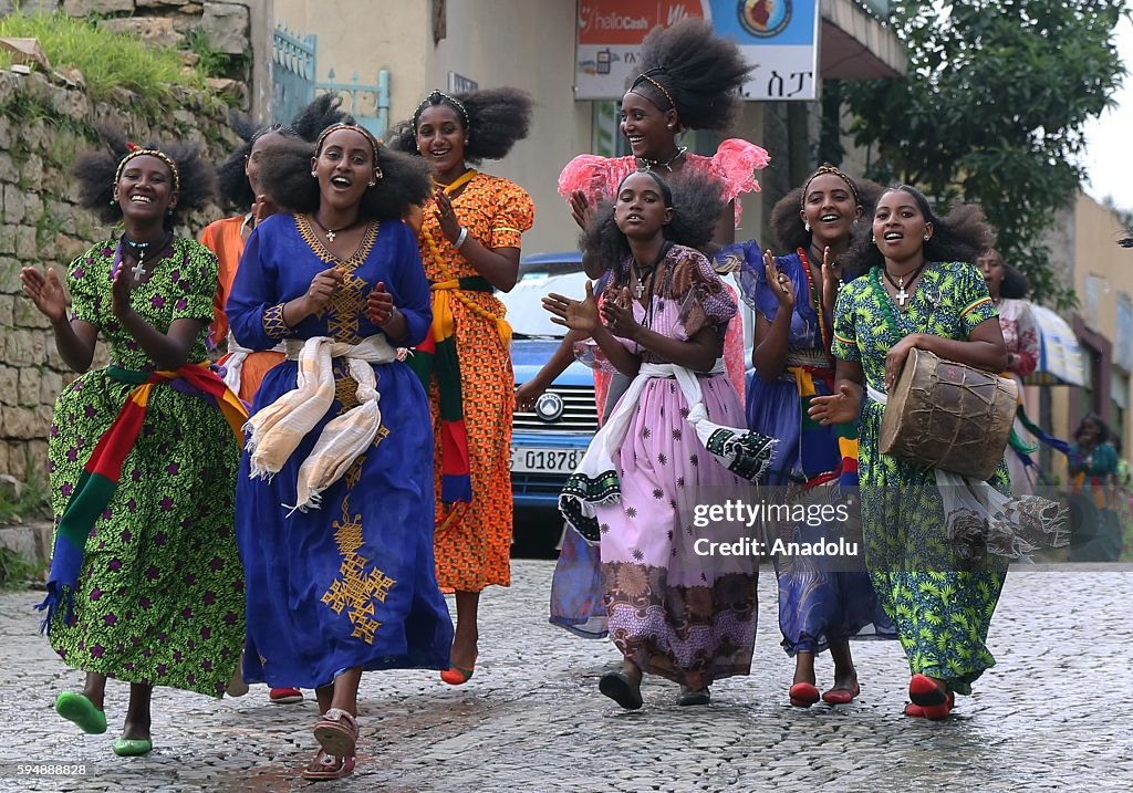Asheda Orthodox Christians wearing traditional outfits observe the Ashenda ...