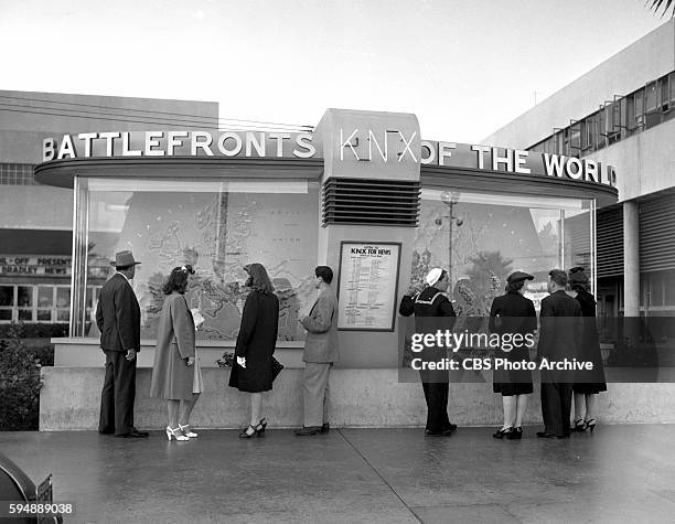 In the forecourt of CBS-KNX Columbia Square, a large display depicting Battlefronts of the World, featuring the latest in war developments. Image...