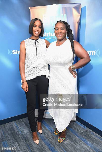 Singer Kelly Rowland and radio host Bevy Smith pose following Smith's show "Bevelations" at SiriusXM Studios on August 24, 2016 in New York City.